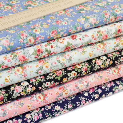 100% cotton poplin fabric with classic country garden rose bouquets in Rose, Copen Blue, Ivory, Meadow Green, Navy & Black by Rose and Hubble