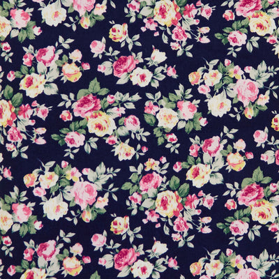 Swatch of 100% cotton poplin fabric with classic country garden rose bouquets in Navy by Rose and Hubble