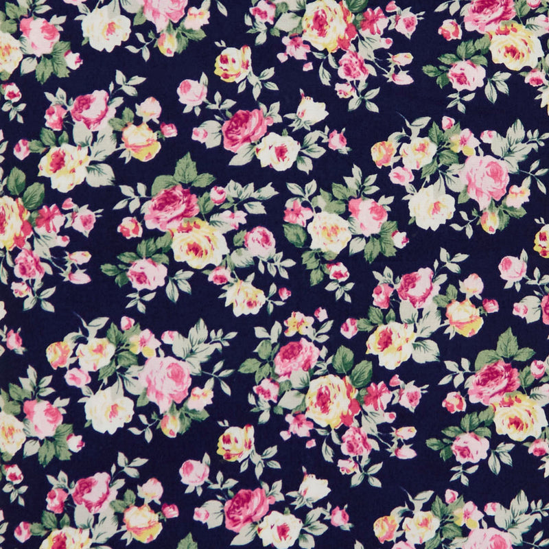 Swatch of 100% cotton poplin fabric with classic country garden rose bouquets in Navy by Rose and Hubble