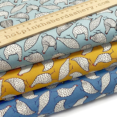 Funky, farm chickens printed on 100% cotton poplin fabric by Rose and Hubble in Copen blue, duck egg blue and ochre yellow