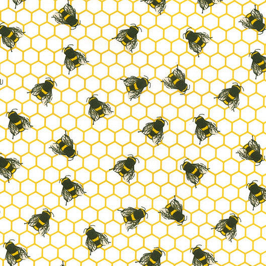 Swatch of fun honey bees on honeycomb printed 100% cotton poplin fabric by Rose and Hubble on ivory and honey yellow