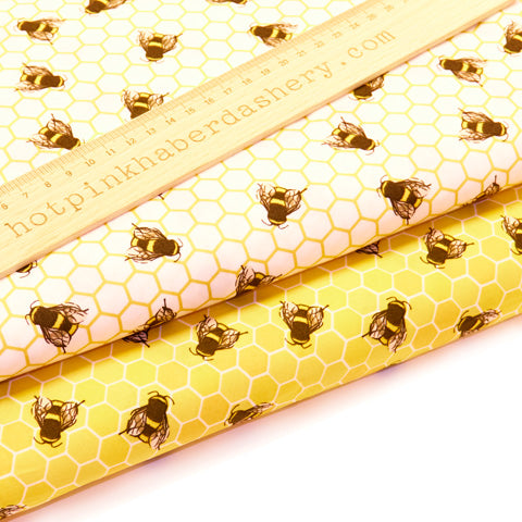 Fun honey bees on honeycomb printed 100% cotton poplin fabric by Rose and Hubble on ivory and honey yellow