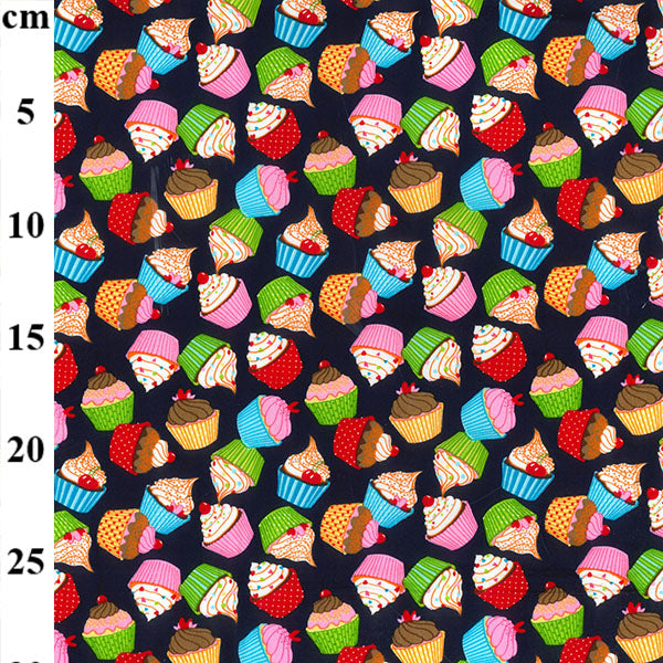 Swatch of funky and colourful cupcake print 100% cotton poplin fabric by Rose and Hubble in Navy