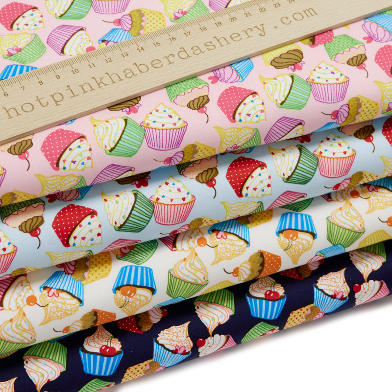 Funky and colourful cupcake print 100% cotton poplin fabric by Rose and Hubble in Cream, Blue, Pink  & Navy