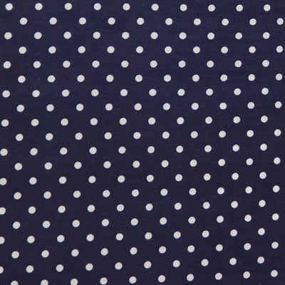 Swatch of fun and classic, bright polka dots in white on polycotton fabric in navy blue