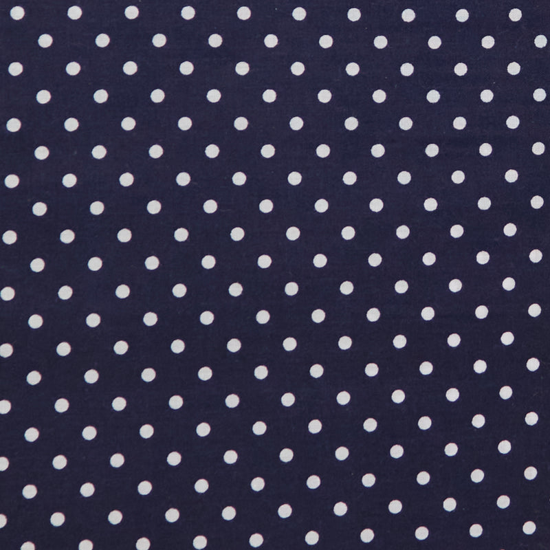 Swatch of fun and classic, bright polka dots in white on polycotton fabric in navy blue