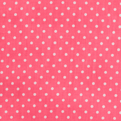 Swatch of fun and classic, bright polka dots in white on polycotton fabric in pink