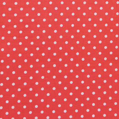 Swatch of fun and classic, bright polka dots in white on polycotton fabric in red