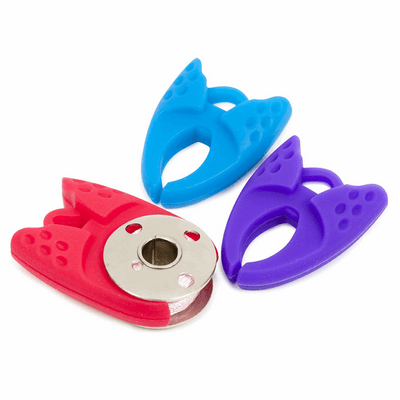 Grippies made of flexible and durable silicone rubber for bobbins in red, blue and purple