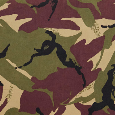Swatch of classic green and brown jungle camouflage print 100% cotton poplin drill fabric.