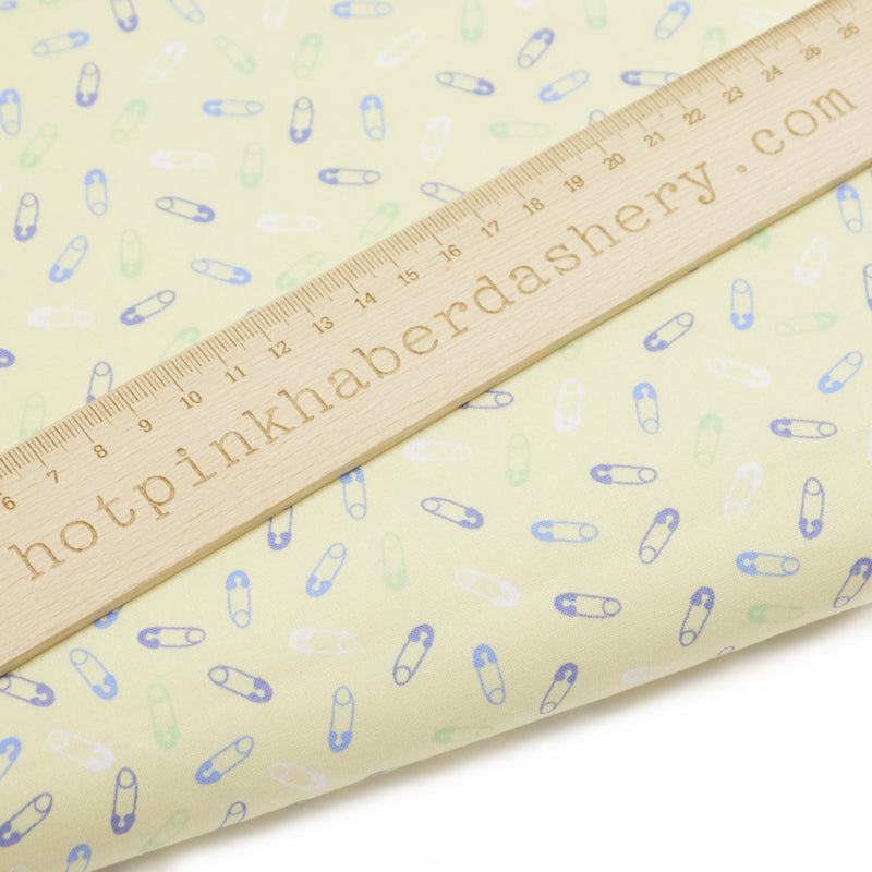Cute baby nappy pins printed on 100% organic cotton fabric by John Louden in yellow, purple and blue