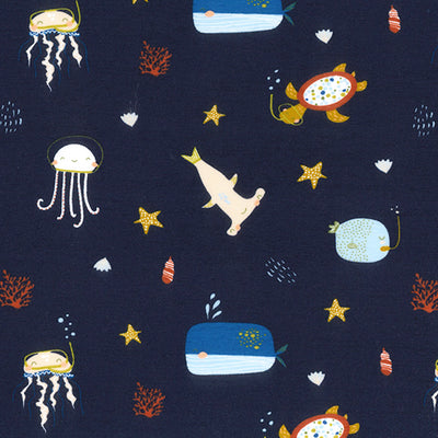 Swatch of under the sea print with turtles, sharks, jelly fish, whales and starfish 100% organic jersey by John Louden in navy blue