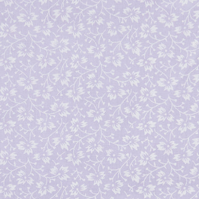 Swatch of elegant, swirling white flowers on pastel polycotton fabric in lilac