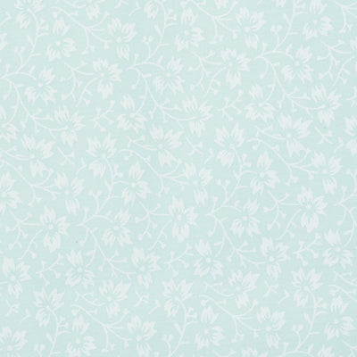 Swatch of elegant, swirling white flowers on pastel polycotton fabric in green