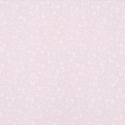 Swatch of elegant, swirling white flowers on pastel polycotton fabric in pink