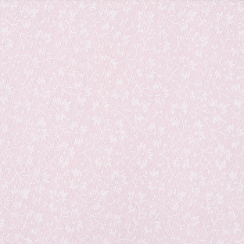 Swatch of elegant, swirling white flowers on pastel polycotton fabric in pink