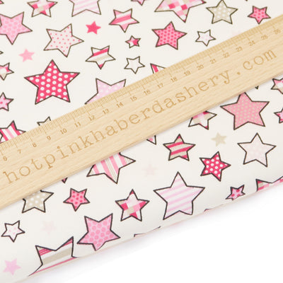 Twinkle stars fabric in 100% cotton by Chatham Glyn - Pink and white