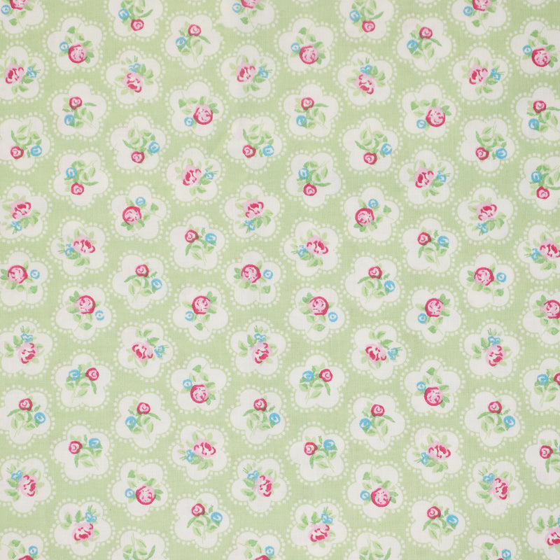 Swatch of Dainty floral rose 100% cotton fabric by Chatham Glyn in lime