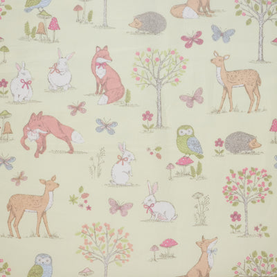 Swatch of woodland animal fabric in 100% cotton by Chatham Glyn in lime