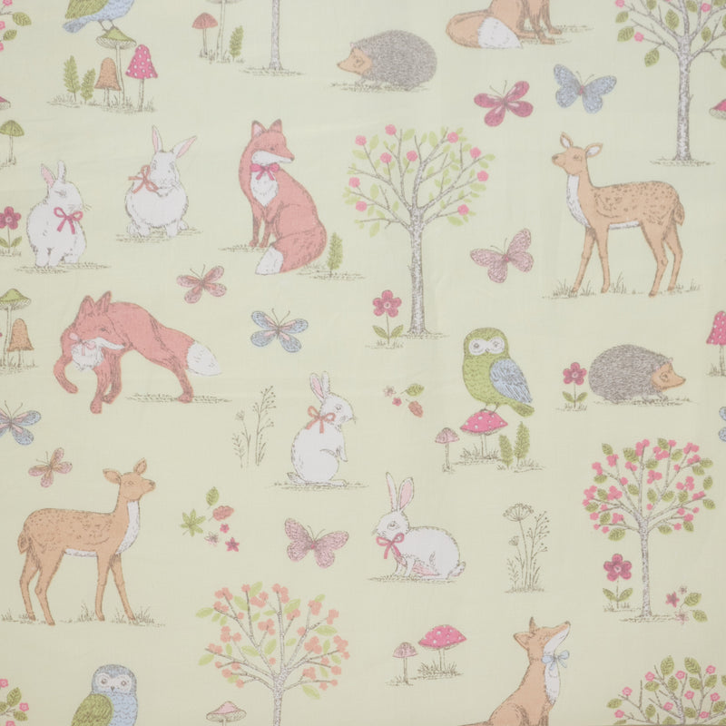 Swatch of woodland animal fabric in 100% cotton by Chatham Glyn in lime