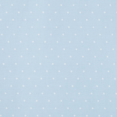 Swatch of small classic polka dot printed polycotton fabric in pastels in blue