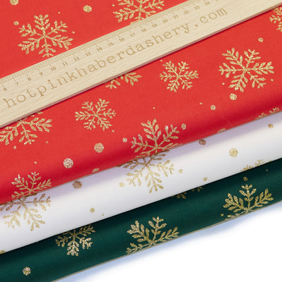 Christmas gold glitter snowflake print 100% cotton poplin Rose & Hubble fabric in red, ivory and green.