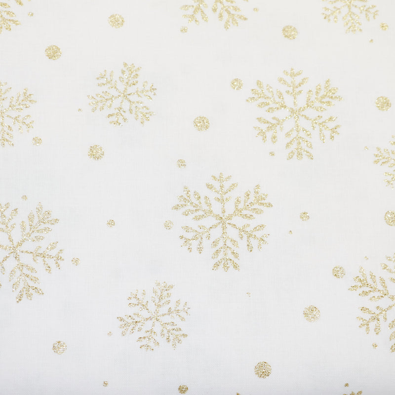 Swatch of Christmas gold glitter snowflake print 100% cotton poplin Rose & Hubble fabric in ivory 