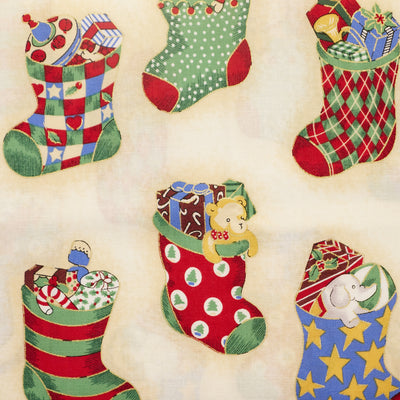 Swatch of classic festive toys In Christmas Stockings printed Rose & hubble 100% Cotton poplin fabric in cream