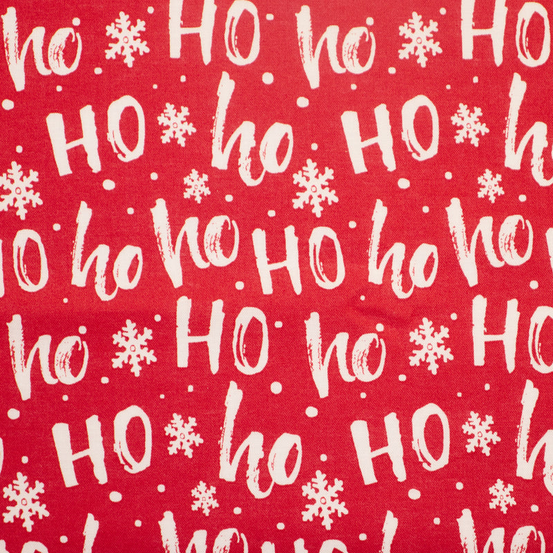 Swatch of fun and festive Christmas santa Ho Ho Ho print with snowflakes  100% cotton poplin fabric by Rose and Hubble in red and cream