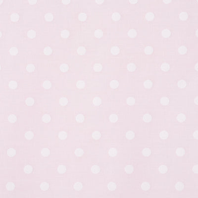 Swatch of classic pastel polka dot printed polycotton fabric in pink