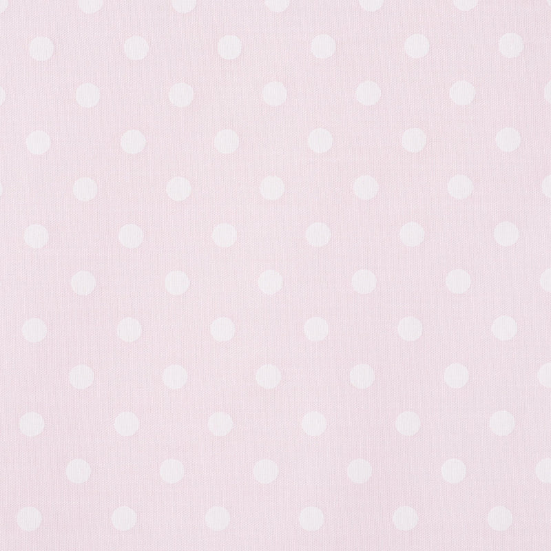 Swatch of classic pastel polka dot printed polycotton fabric in pink
