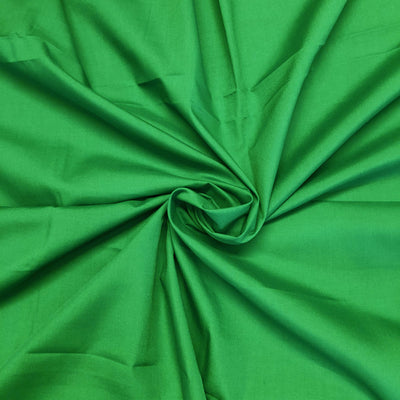 Plain polycotton fabric swatch in grass green 21
