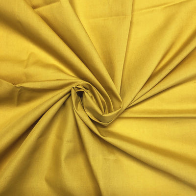 Plain polycotton fabric swatch in mustard 24