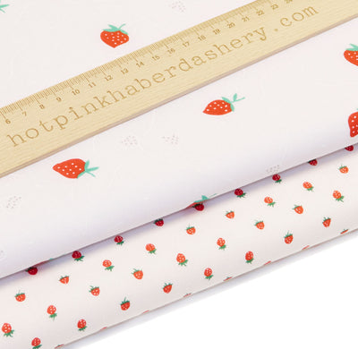 Fun and cute red strawberries fruit print white polycotton fabric