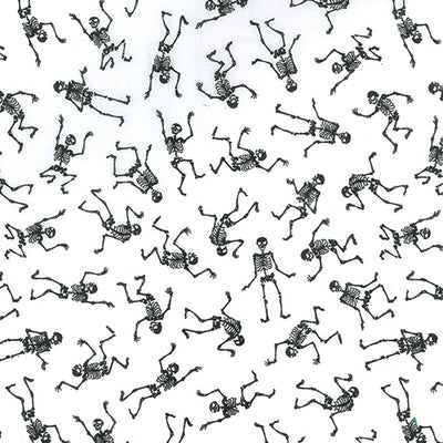 Swatch of dancing, spooky Halloween skeletons on polycotton fabric in white and black