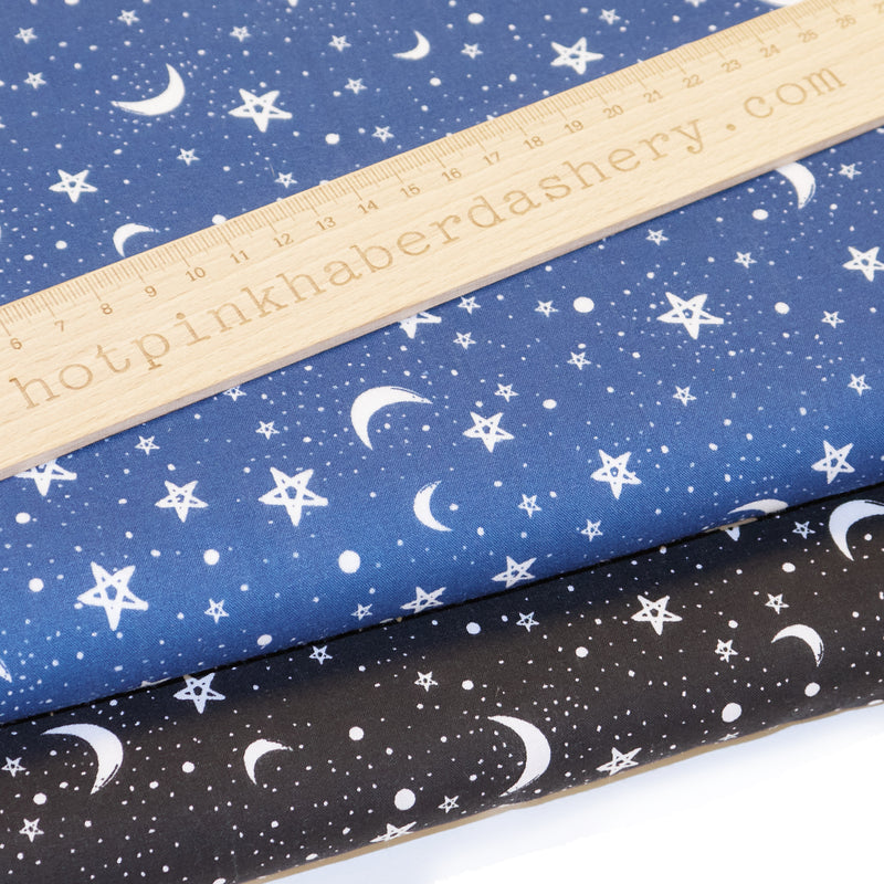 Halloween or Christmas night sky with moon and stars print polycotton fabric in navy and black