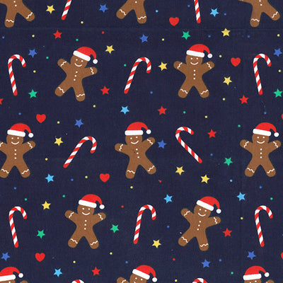 Swatch of festive gingerbread and Christmas candy canes with stars and Santa hats on polycotton fabric in navy blue
