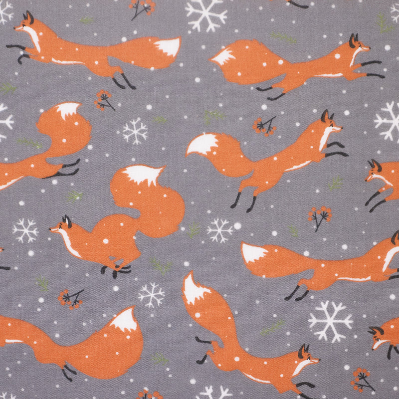 Swatch of playful Christmas winter foxes with festive snowflakes on polycotton fabric in grey