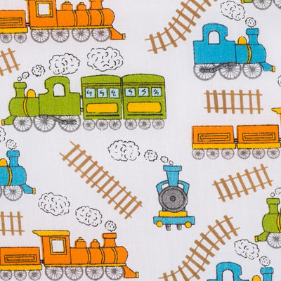 Swatch of children's steam trains and tracks printed polycotton fabric in white with green and orange