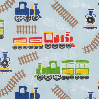 Swatch of children's steam trains and tracks printed polycotton fabric in sky blue