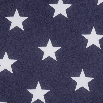 Swatch of fun and bold white stars on polycotton fabric in navy blue