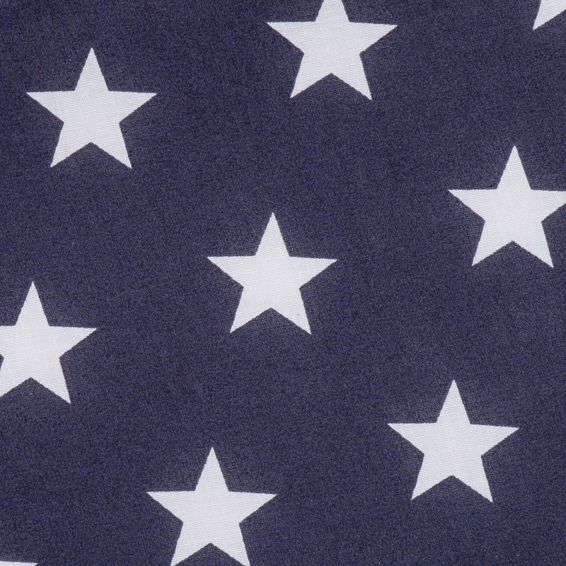 Swatch of fun and bold white stars on polycotton fabric in navy blue