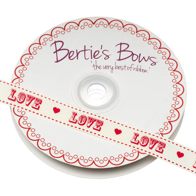 Bertie's Bows grosgrain ribbon in red with ivory printed 'Love' design.